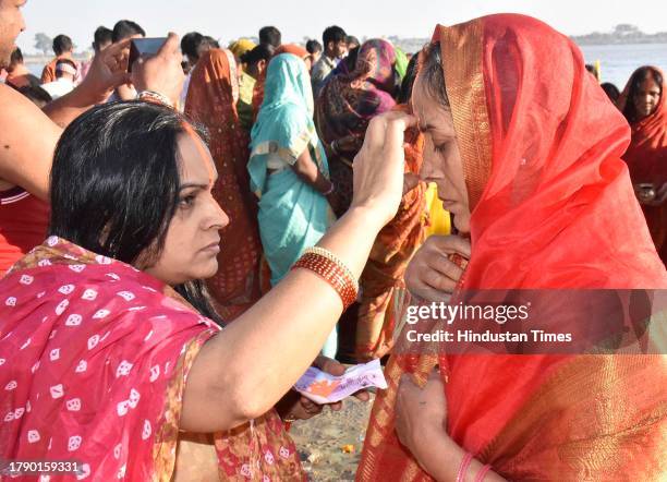 Chhath devotees perform rituals at the bank of Ganga river on the occasion of 'Kharna Puja' during Chhath Puja festival at NIT Ghat on November 18,...