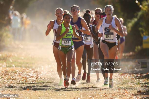 Brianna Robles and Natalie Graber run side by side during the Division II Women's Cross Country Championship held at Tom Rutledge Cross Country...