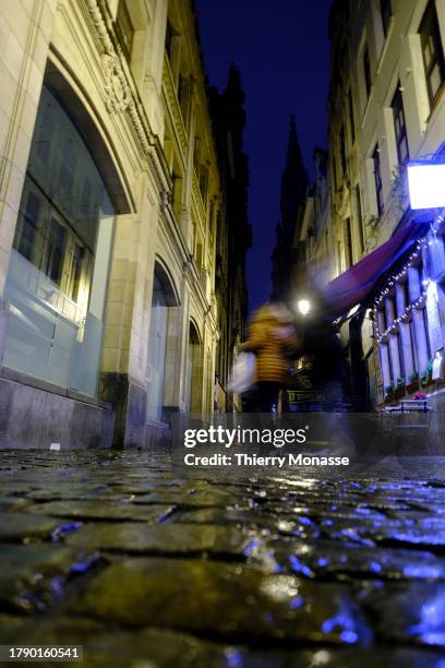 Despite the rain, tourists enjoy the nightlife in the street of the 'Îlot Sacré' on November 18, 2023 in Brussels, Belgium. In Brussels the month of...