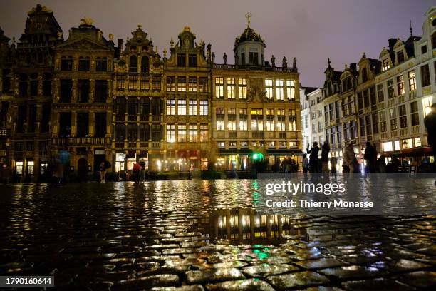 Despite the rain, tourists enjoy the nightlife in the street of the 'Grand-Place' on November 18, 2023 in Brussels, Belgium. In Brussels the month of...