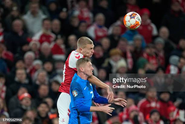 Rasmus Kristensen and Benjamin Verbic battle for the ball during a Group H EURO 2024 Qualification game, Denmark versus Slovenia, at Parken,...