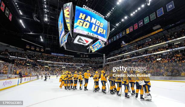 The Nashville Predators celebrate a 4-2 win against the Chicago Blackhawks during an NHL game at Bridgestone Arena on November 18, 2023 in Nashville,...