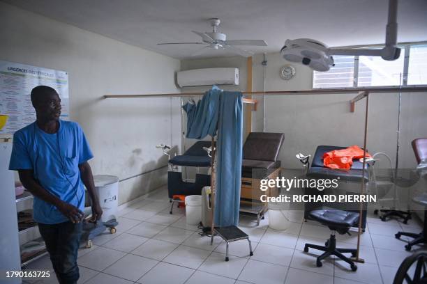 Hospital worker shows the damage inside Fontaine Hospital 3 days after an armed attack forced its closure in the Cité Soleil district of...