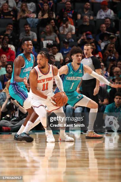 Jalen Brunson of the New York Knicks handles the ball during the game against the Charlotte Hornets on November 18, 2023 at Spectrum Center in...