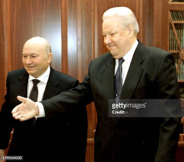 Russian President Boris Yeltsin invites Moscow's mayor Yuri Luzhkov to start their talks at Moscow's Kremlin, 13 April 1999. The President and the...