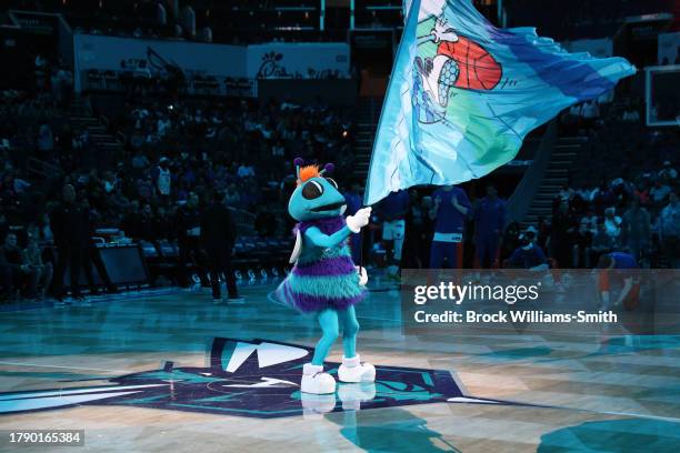 Mascot Hugo the Hornet of the Charlotte Hornets hypes up crowd before the game against the New York Knicks on November 18, 2023 at Spectrum Center in...