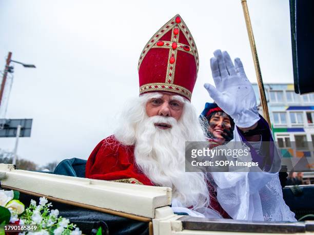 Closer portrait of St. Nicholas cheering the people on the streets. The first Saturday after November 11th, the red-and-white-clad Sinterklaas...