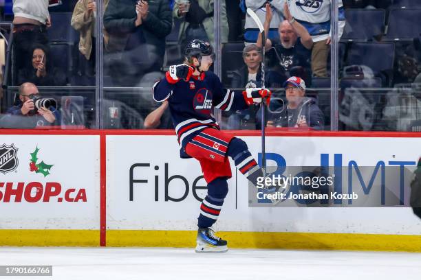 Kyle Connor of the Winnipeg Jets celebrates after scoring a second period goal against the Arizona Coyotes at the Canada Life Centre on November 18,...