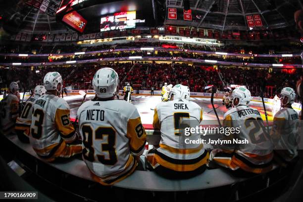 Matt Nieto, Ryan Shea, Marcus Pettersson of the Pittsburgh Penguins sit on the bench before the first period of the game against the Carolina...