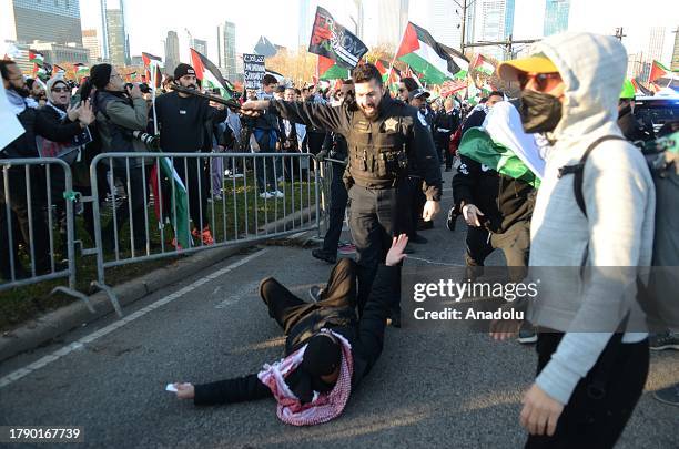 Pro-Palestinian demonstrators hold a rally near Buckingham Fountain on Nov. 18 in Chicago, USA. Protestors and Chicago police clashed onto DuSable...