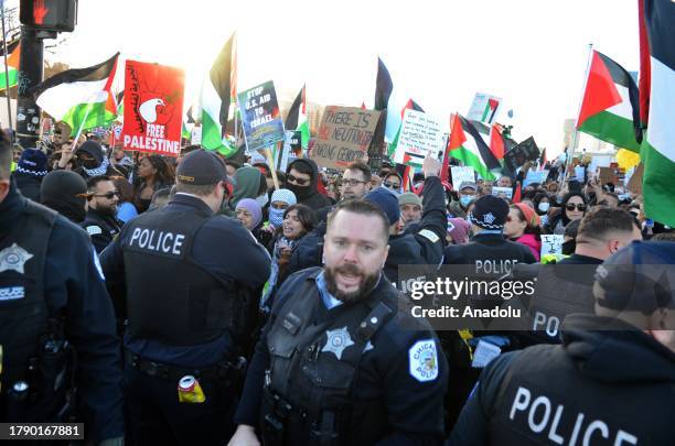 Pro-Palestinian demonstrators hold a rally near Buckingham Fountain on Nov. 18 in Chicago, USA. Protestors and Chicago police clashed onto DuSable...