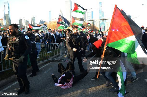 Pro-Palestinian demonstrators hold a rally near Buckingham Fountain on Nov. 18 in Chicago, USA. Protestors and Chicago police clashed onto DuSable...