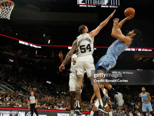 Santi Aldama of the Memphis Grizzlies shoots over Sandro Mamukelashvili of the San Antonio Spurs in the second half at Frost Bank Center on November...