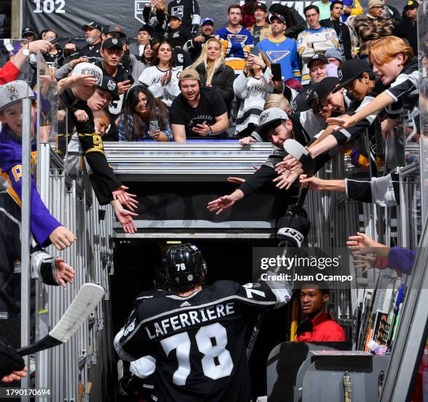 Alex Laferriere of the Los Angeles Kings celebrates their victory with fans against the St. Louis Blues at Crypto.com Arena on November 18, 2023 in...