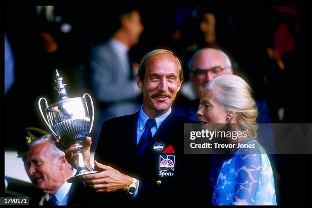 Stan Smith of the US holds trophy during Wimbeldon in London, England. Mandatory Credit: Trevor Jones /Allsport