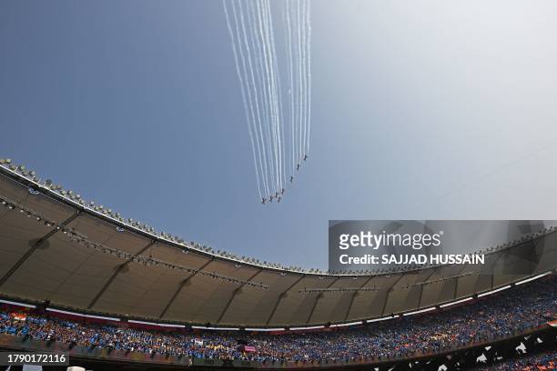 The Indian Air Force Surya Kiran aerobatics team performs before the start of the 2023 ICC Men's Cricket World Cup one-day international final match...
