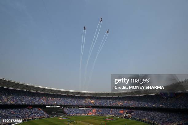 The Indian Air Force Surya Kiran aerobatics team performs before the start of the 2023 ICC Men's Cricket World Cup one-day international final match...