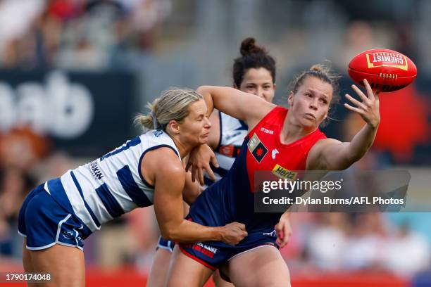 Maddison Gay of the Demons is tackled by Kate Surman of the Cats during the 2023 AFLW Second Semi Final match between The Melbourne Demons and The...