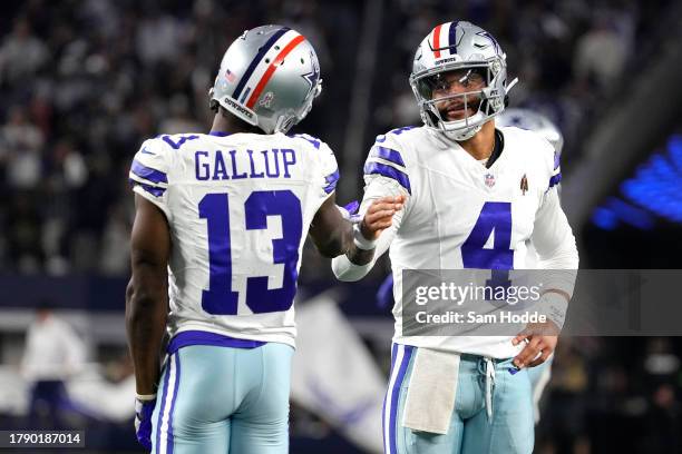 Dak Prescott of the Dallas Cowboys celebrates a touchdown pass with Michael Gallup of the Dallas Cowboys during the third quarter against the New...