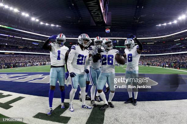 DaRon Bland of the Dallas Cowboys celebrates with teammates after an interception during the third quarter against the New York Giants at AT&T...