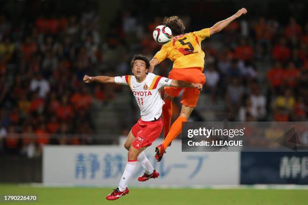 Kensuke Nagai of Nagoya Grampus and Dejan Jakovic of Shimizu S-Pulse compete for the ball during the J.League J1 second stage match between Shimizu...