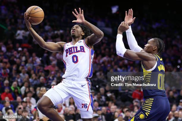 Tyrese Maxey of the Philadelphia 76ers shoots a lay up past Bennedict Mathurin of the Indiana Pacers during the second quarter at the Wells Fargo...