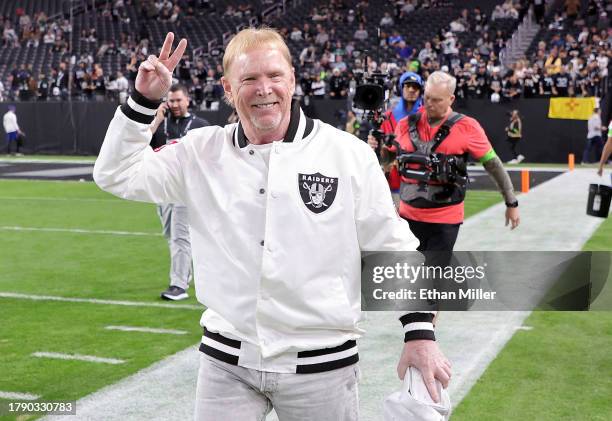 Owner and managing general partner Mark Davis of the Las Vegas Raiders gestures as he walks onto the field during warmups before a game against the...