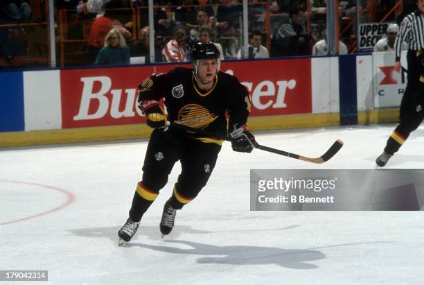 Pavel Bure of the Vancouver Canucks skates on the ice during an NHL game against the Los Angeles Kings circa 1993 at the Great Western Forum in...
