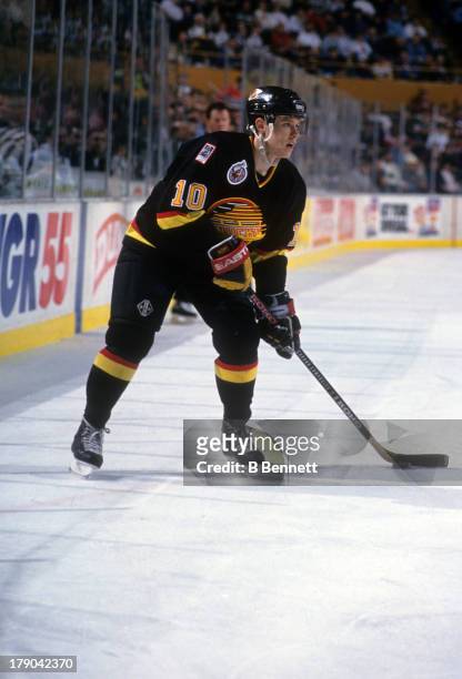 Pavel Bure of the Vancouver Canucks skates with the puck during an NHL game against the New Jersey Devils circa 1993 at the Brendan Byrne Arena in...