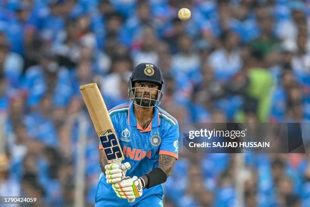 India's Suryakumar Yadav watches the ball after playing a shot during the 2023 ICC Men's Cricket World Cup one-day international final match between...