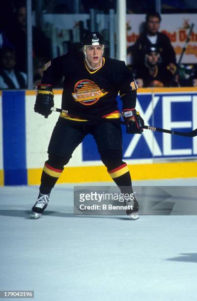 Pavel Bure of the Vancouver Canucks skates on the ice during an NHL game against the Winnipeg Jets circa 1994 at the Winnipeg Arena in Winnipeg,...