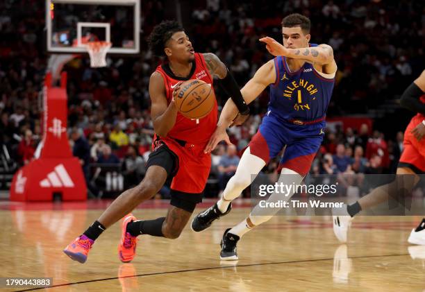 Jalen Green of the Houston Rockets drives to the basket against Michael Porter Jr. #1 of the Denver Nuggets in the second half at Toyota Center on...