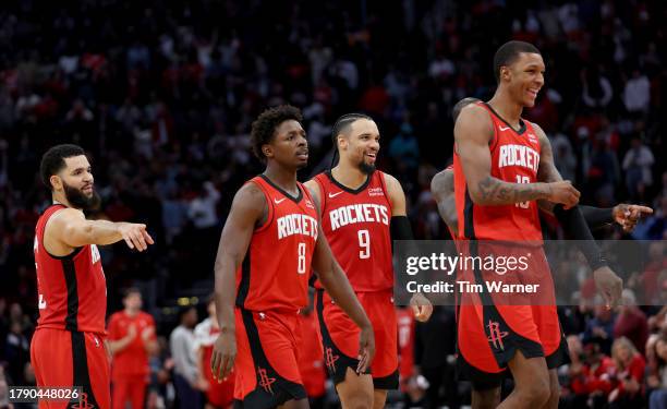 The Houston Rockets celebrate in the second half against the Denver Nuggets at Toyota Center on November 12, 2023 in Houston, Texas. NOTE TO USER:...