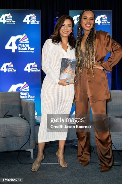 Eva Longoria and Kerry Washington pose onstage with Kerry Washington's book "Thicker Than Water" at An Afternoon With Kerry Washington In...