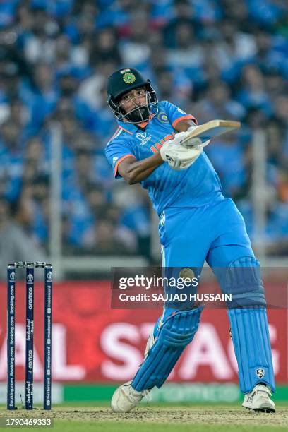 India's Mohammed Siraj plays a shot during the 2023 ICC Men's Cricket World Cup one-day international final match between India and Australia at the...