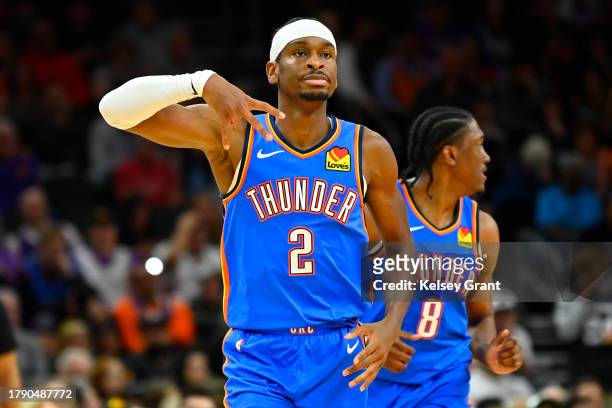 Shai Gilgeous-Alexander of the Oklahoma City Thunder gestures after scoring a three-pointer in the second half against the Phoenix Suns at Footprint...