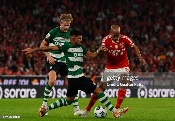 Joao Mario of SL Benfica with Ricardo Esgaio of Sporting CP and Morten Hjulmand of Sporting CP in action during the Liga Portugal Betclic match...