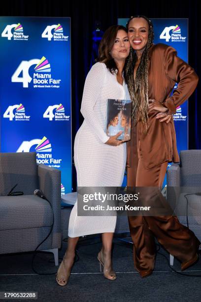 Eva Longoria and Kerry Washington pose onstage with Kerry Washington's book "Thicker Than Water" at An Afternoon With Kerry Washington In...