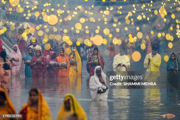Hindu devotees offer prayers to Sun God, on 'Chhath Puja' in Jalandhar on November 19, 2023.