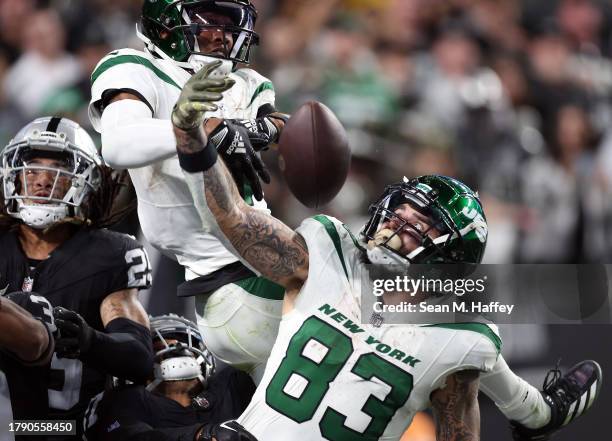 Ide receiver Garrett Wilson and tight end Tyler Conklin of the New York Jets fail to pull down the Hail Mary pass on the final play of the game...