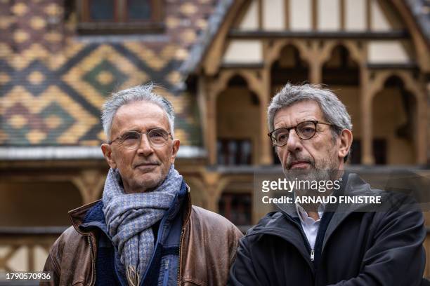 Patrons of the 163rd Beaune charity wine auction, French actor Thierry Lhermitte and French TV personality Michel Cymes , pose ahead of the auction...