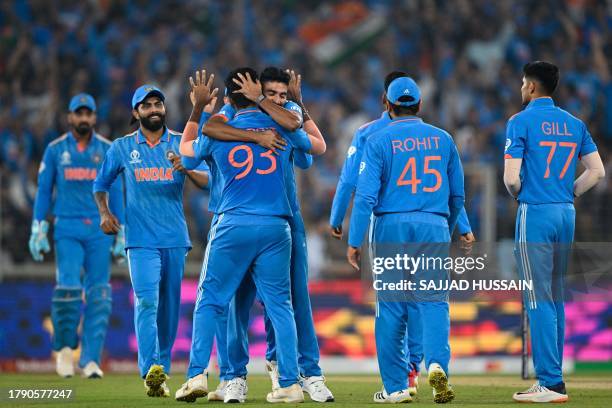 India's players celebrate after the dismissal of Australia's Mitchell Marsh during the 2023 ICC Men's Cricket World Cup one-day international final...