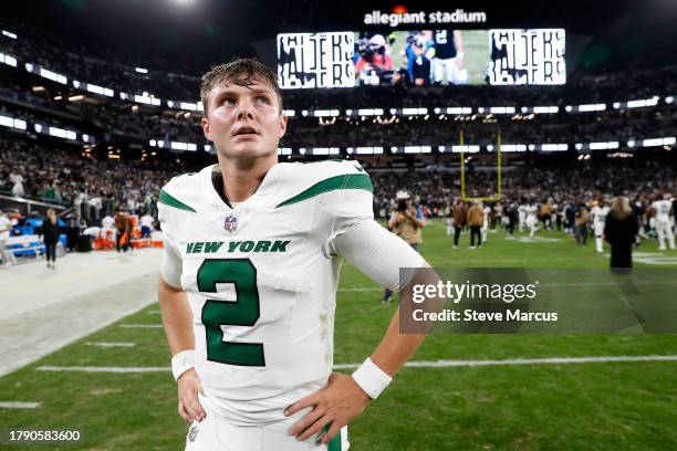 Quarterback Zach Wilson of the New York Jets walks off the field after the Las Vegas Raiders defeated the Jets to win the game at Allegiant Stadium...