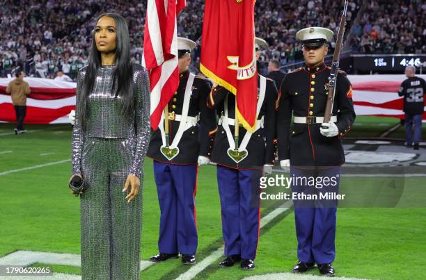 Michelle Williams prepares to sing the United States national anthem before a game between the New York Jets and the Las Vegas Raiders at Allegiant...