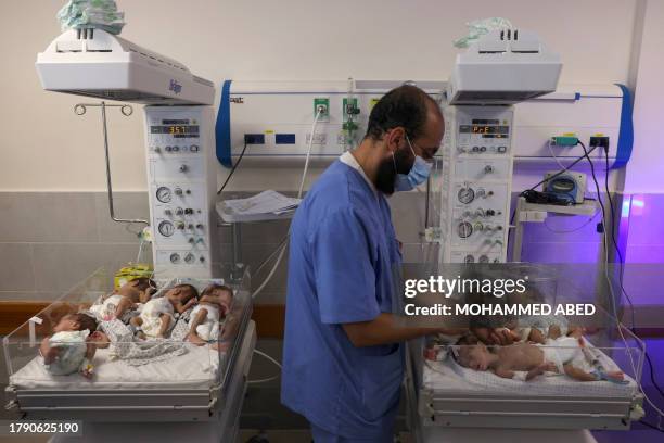 Palestinian medic cares for premature babies evacuated from Al Shifa hospital to the Emirates hospital in Rafah in the southern Gaza Strip, on...