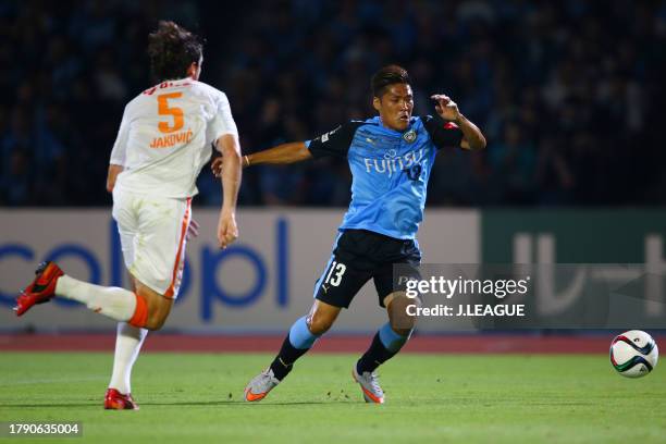 Yoshito Okubo of Kawasaki Frontale controls the ball against Dejan Jakovic of Shimizu S-Pulse during the J.League J1 second stage match between...