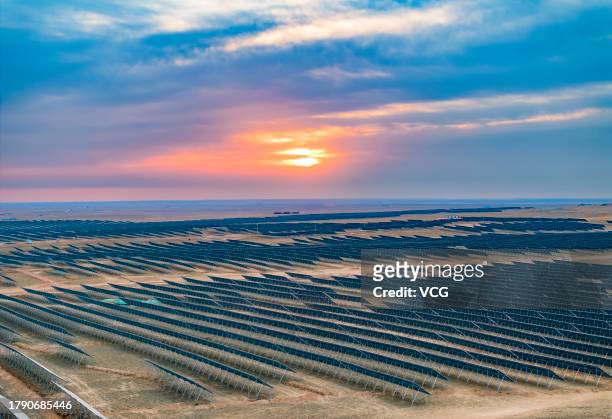 Aerial view of a 400MW photovoltaic power generation project in a mining subsidence area on November 11, 2023 in Ordos, Inner Mongolia Autonomous...