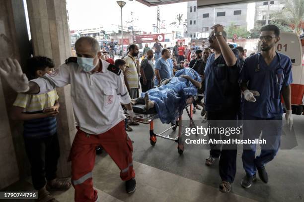 Palestinians injured in Israeli raids arrive at Nasser Medical Hospital on November 13, 2023 in Khan Yunis, Gaza. Heavy fighting rages in the...