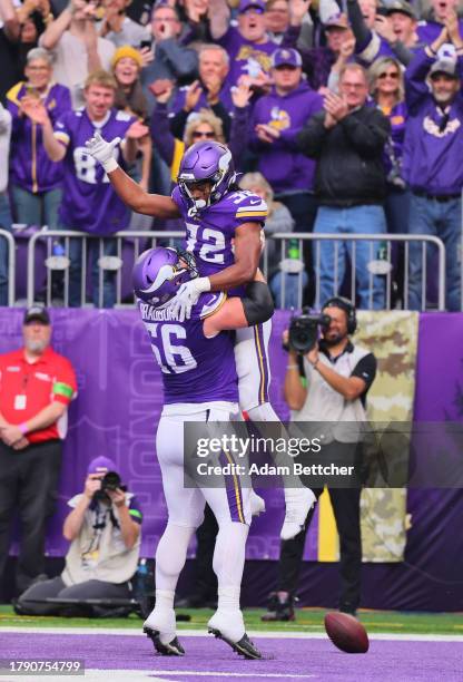 Ty Chandler celebrates his first NFL touchdown with Garrett Bradbury of the Minnesota Vikings against New Orleans Saints in the first half at U.S....