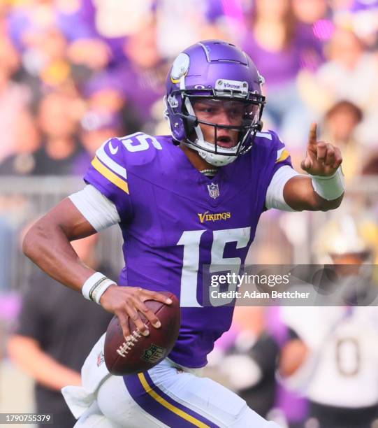 Joshua Dobbs of the Minnesota Vikings runs for a touchdown against New Orleans Saints in the first half at U.S. Bank Stadium on November 12, 2023 in...